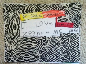 This work of art is a book with facts about zebras,beautiful illustrations, and a cover made with pieced together zebra duct tape. 
